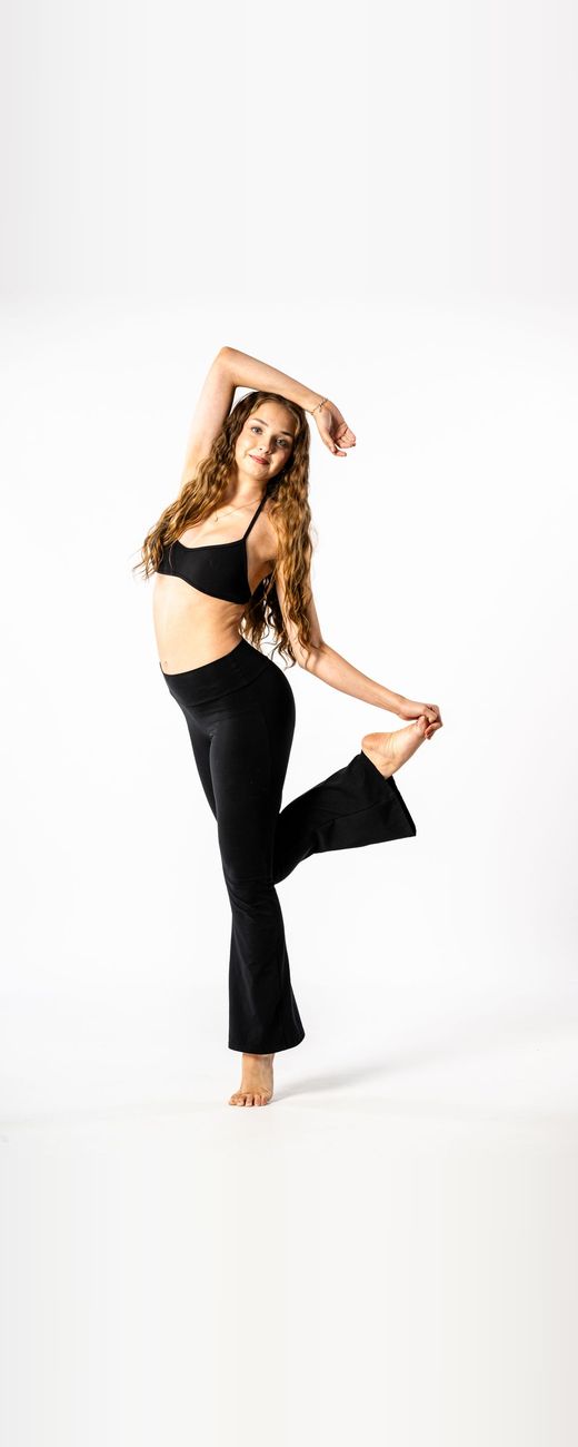 Dancer in black holding a contemporary pose